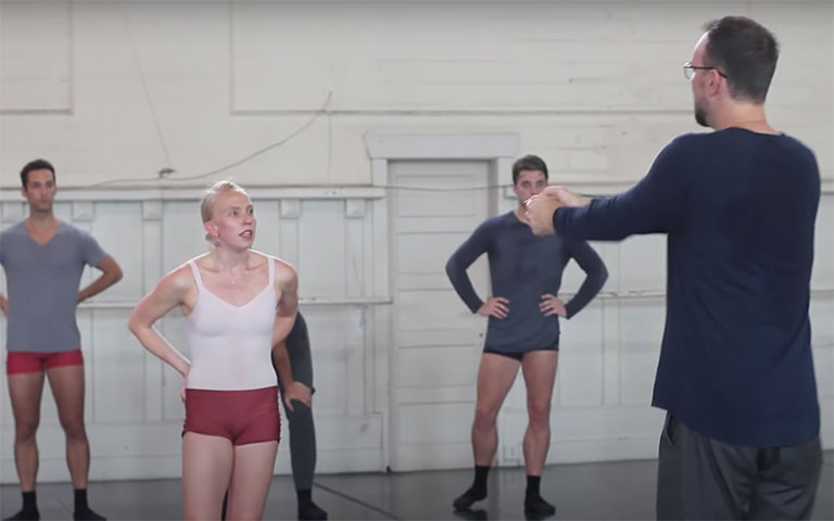 Trey McIntyre instructing dancers in a studio