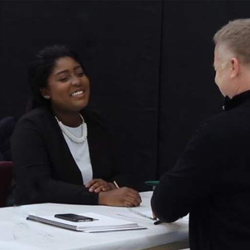 Student interviewing at job fair