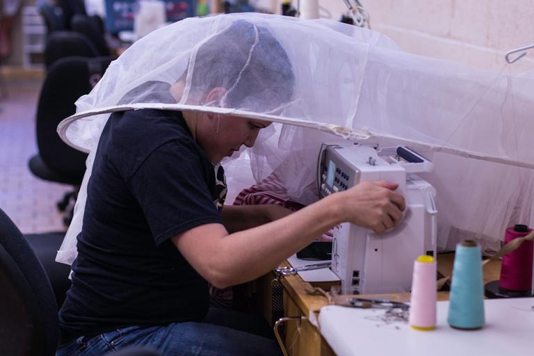 Kaitlin Fara works on Mother Ginger's hoop skirt