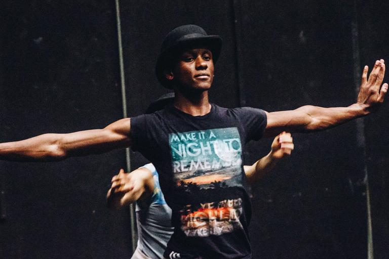 Zeek Page with one of his duet partners Saki Morimoto behind him. 