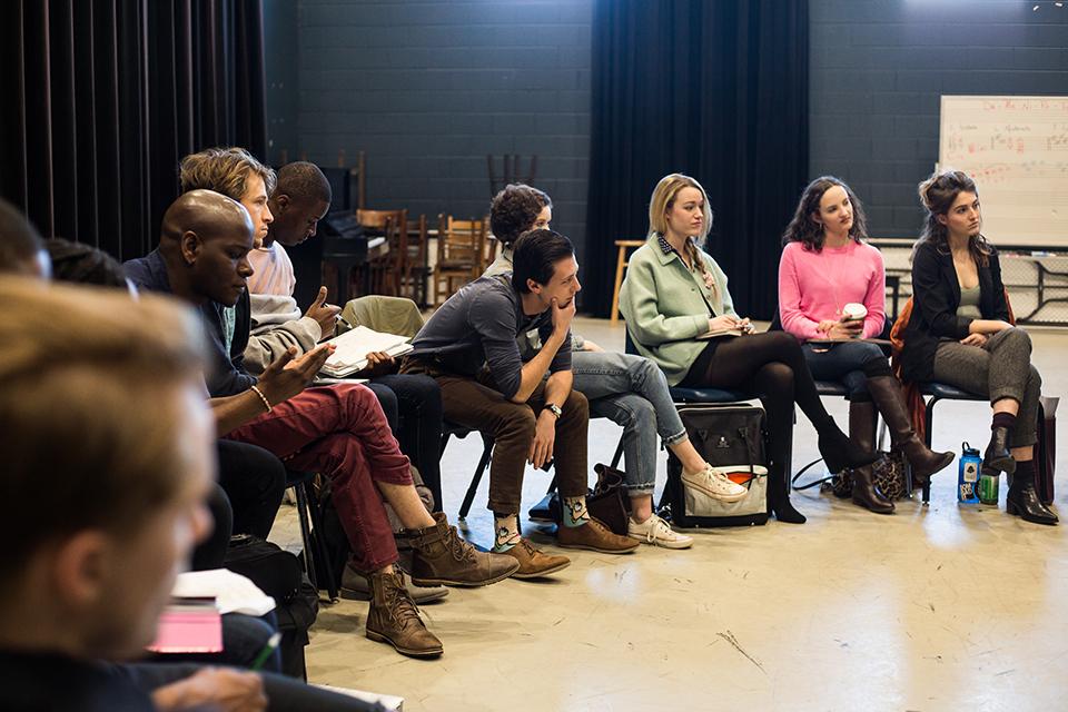 Fourth-year drama students listen attentively to alumni Magnussen and Andries. 