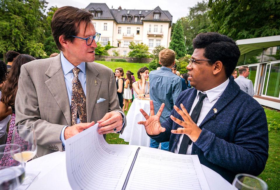 Tyson J. Davis (right) talking with David Mees, Cultural Attache to the U.S. Embassy in Berlin. / Photo: Chris Lee Photographer