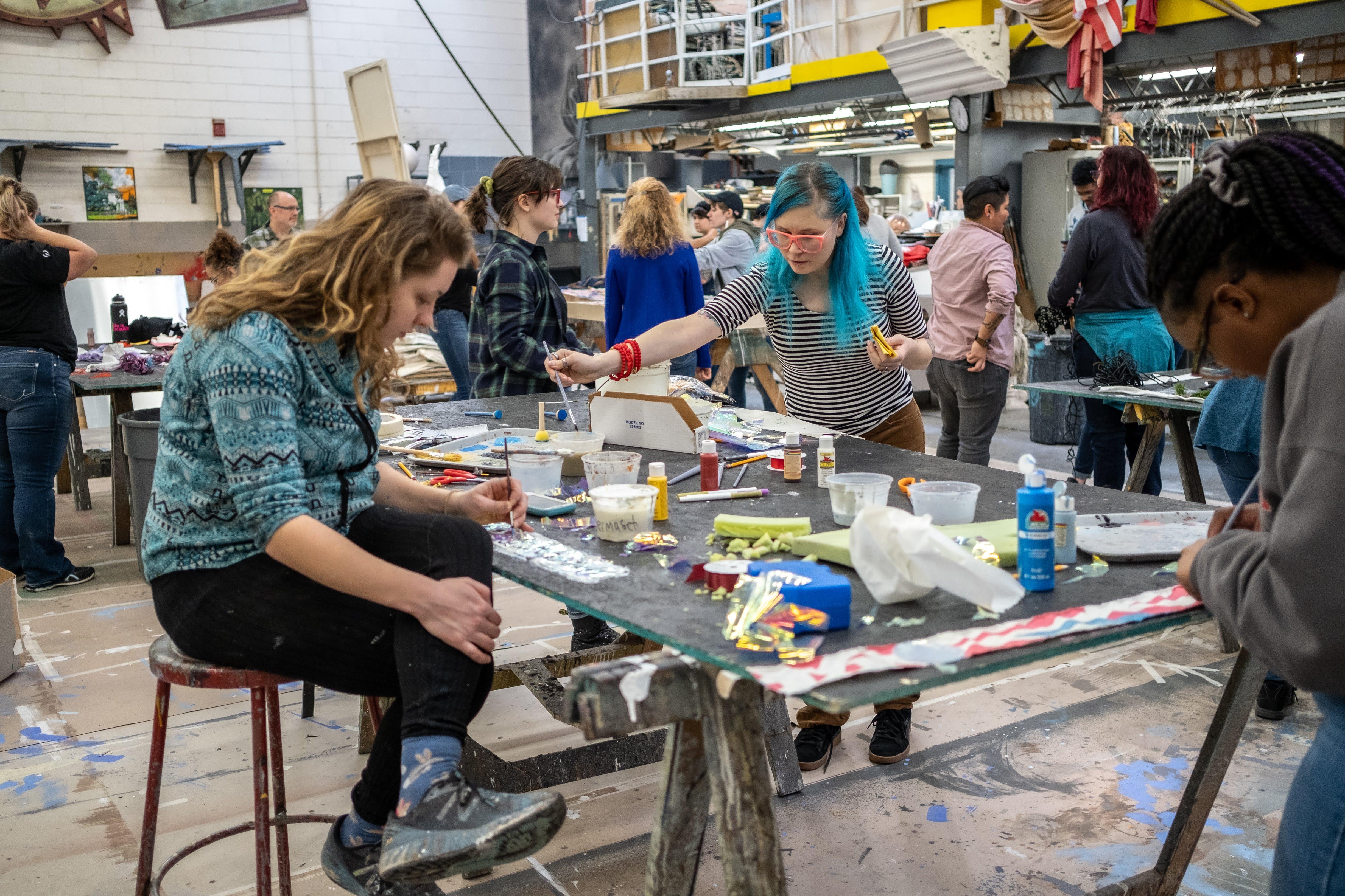 Karen Walcott, Shannon Hacker and Camryn Banks work on their strips of cloth for the "Future" project. / Photo: Raunak Kapoor