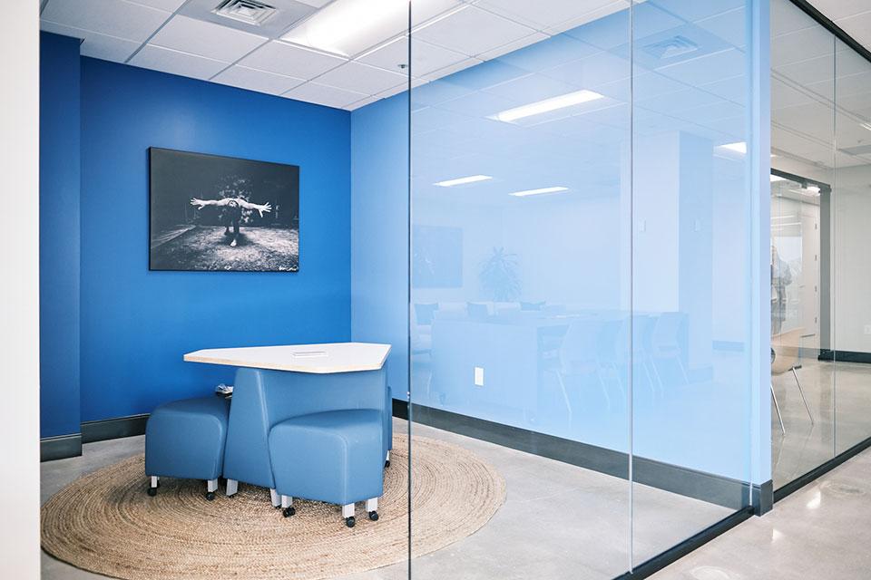 Individual meeting rooms offer space for smaller collaborations and conversations.