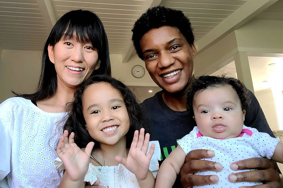 McMichael at home with her wife and daughters.