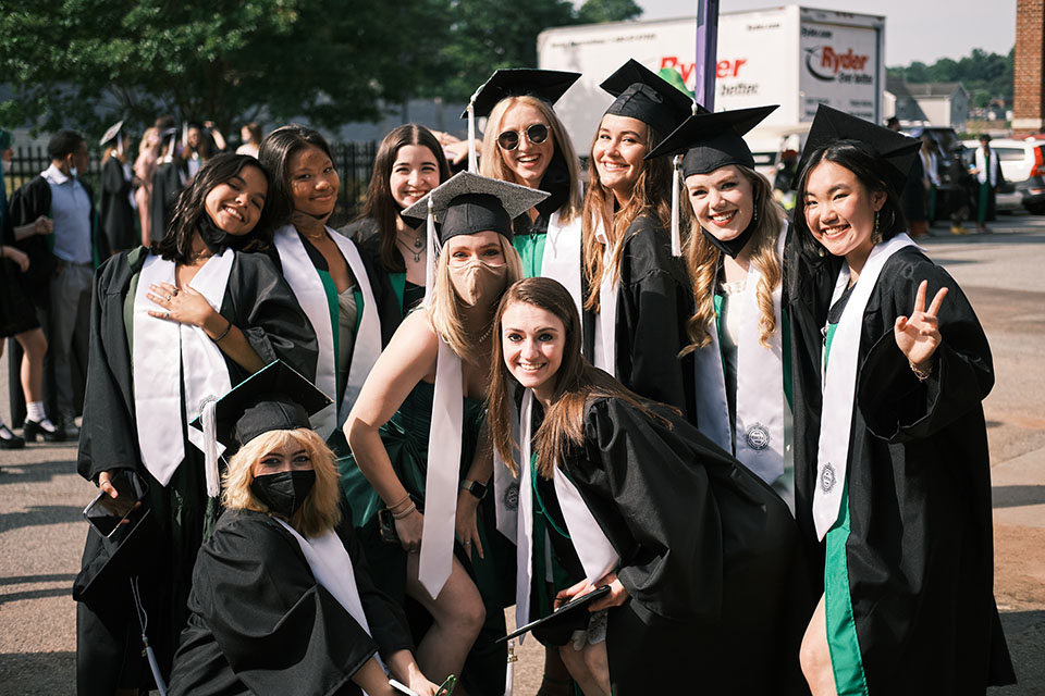 High School graduates pose together before their commencement ceremony at Truist Stadium. / Photo: Wayne Reich