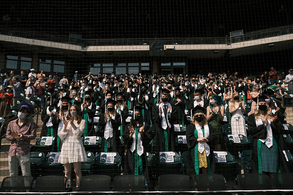 Graduates applaud at the High School Commencement ceremony. / Photo: Wayne Reich