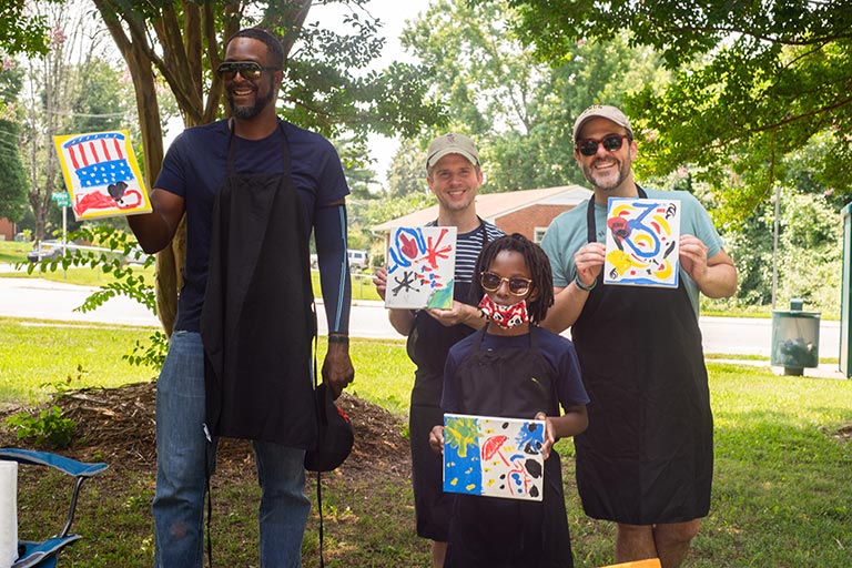 Artists with the Neighborhood Arts Residency Program host a community art event in the Kings Forest neighborhood.