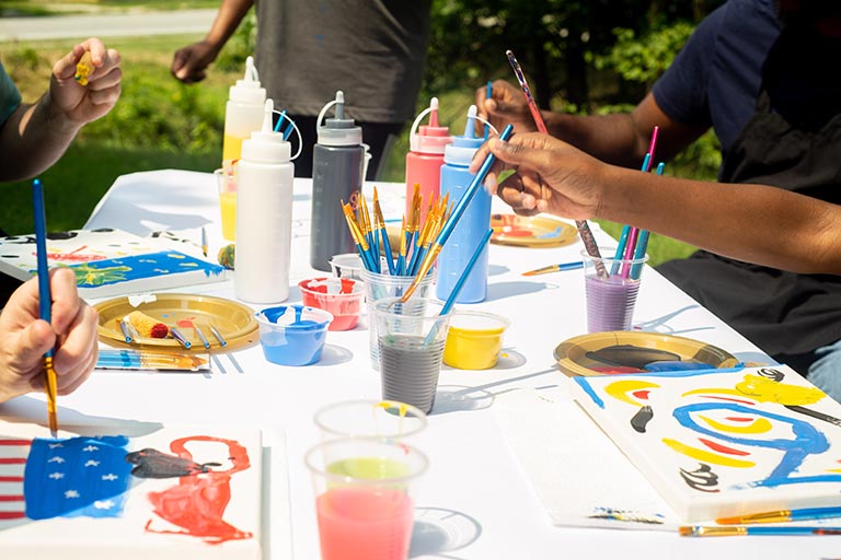 Artists with the Neighborhood Arts Residency Program host a community art event in the Kings Forest neighborhood.