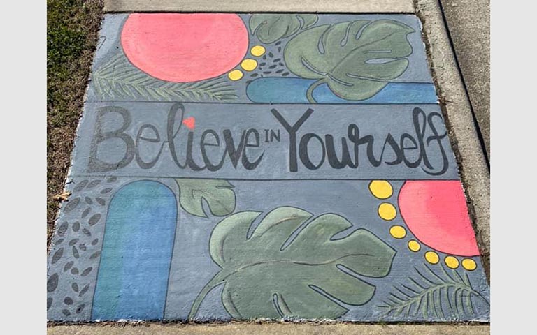 Murals painted on sidewalks, benches and picnic tables in the Kings Forest neighborhood in November 2021. / Photos: Ryan Deal