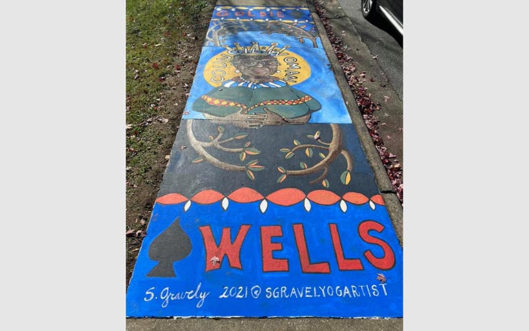 Murals painted on sidewalks, benches and picnic tables in the Kings Forest neighborhood in November 2021. / Photos: Ryan Deal