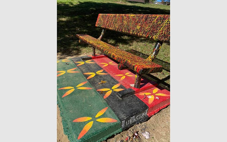 Murals painted on sidewalks, benches and picnic tables in the Kings Forest neighborhood in November 2021. / Photos: Ryan Deal