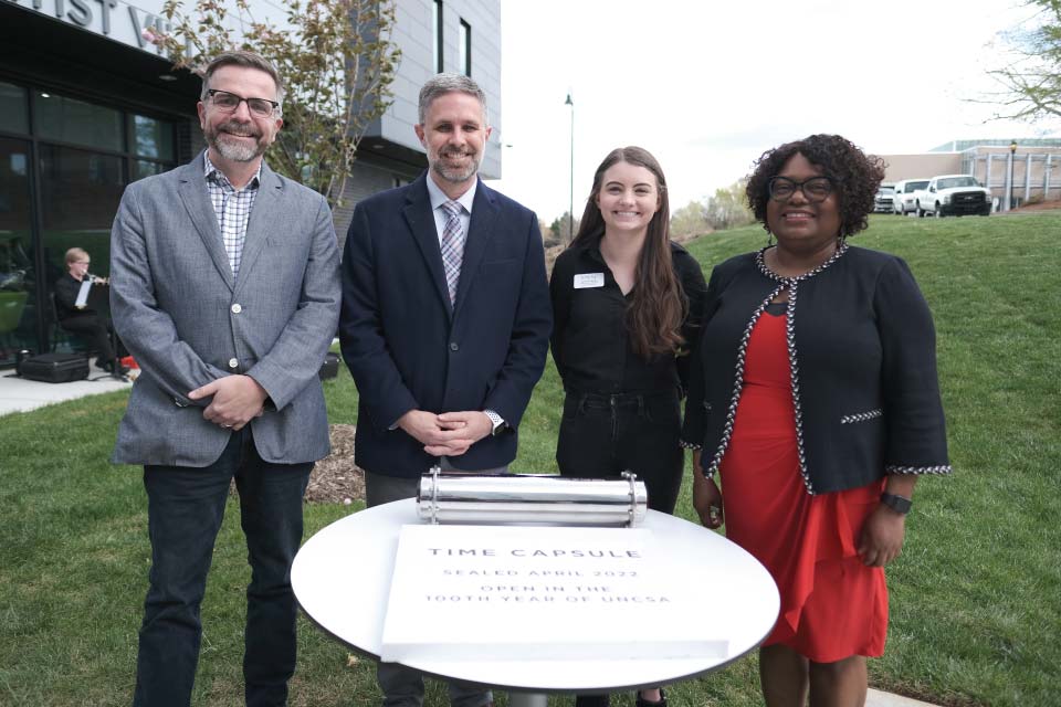 The Artist Village Time Capsule was buried on Friday, April 8, 2022. It will be opened in the 100th year of UNCSA. / Photo: Wayne Reich