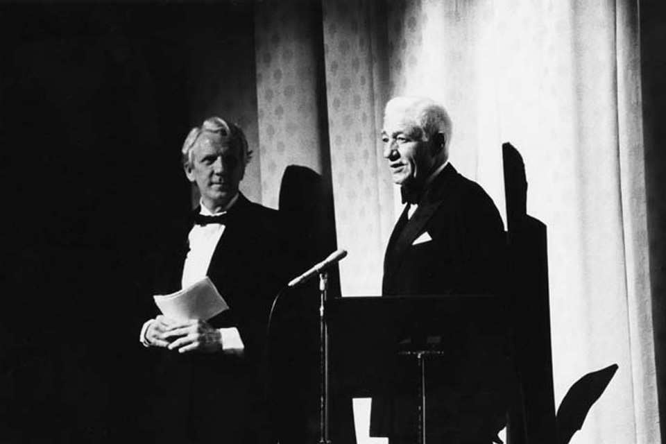 Chancellor Robert Suderburg (left) and Oliver Smith on stage at the Stevens Center opening on April 22, 1983. / Photo credit: UNCSA Archives