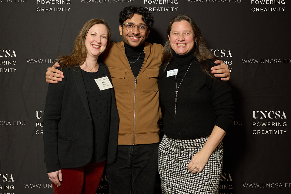 Rohit Lila Ram hugging mentor and "American mom"and Kenan Scholar Liason Erin Edge and former UNCSA Director of Alumni Engagement Amy Werner at the 2023 UNCSA Scholarship Luncheon. / Photo: Wayne Reich