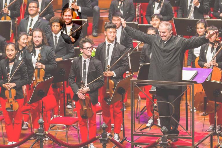 Emi Sharpe, violinist, stands at the conclusion of the Amsterdam concert with conductor Valery Gergiev. Photo: Chris Lee