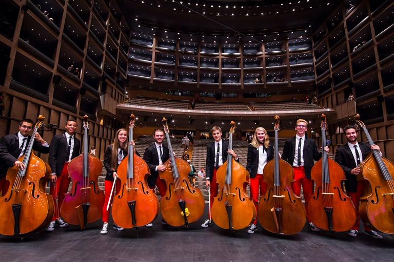 Ella Sharpe, third from the right, poses with fellow bassist in Smetana Hall in Prague. Photo: Chris Lee