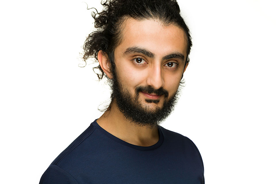 Headshot, smiling, on white background