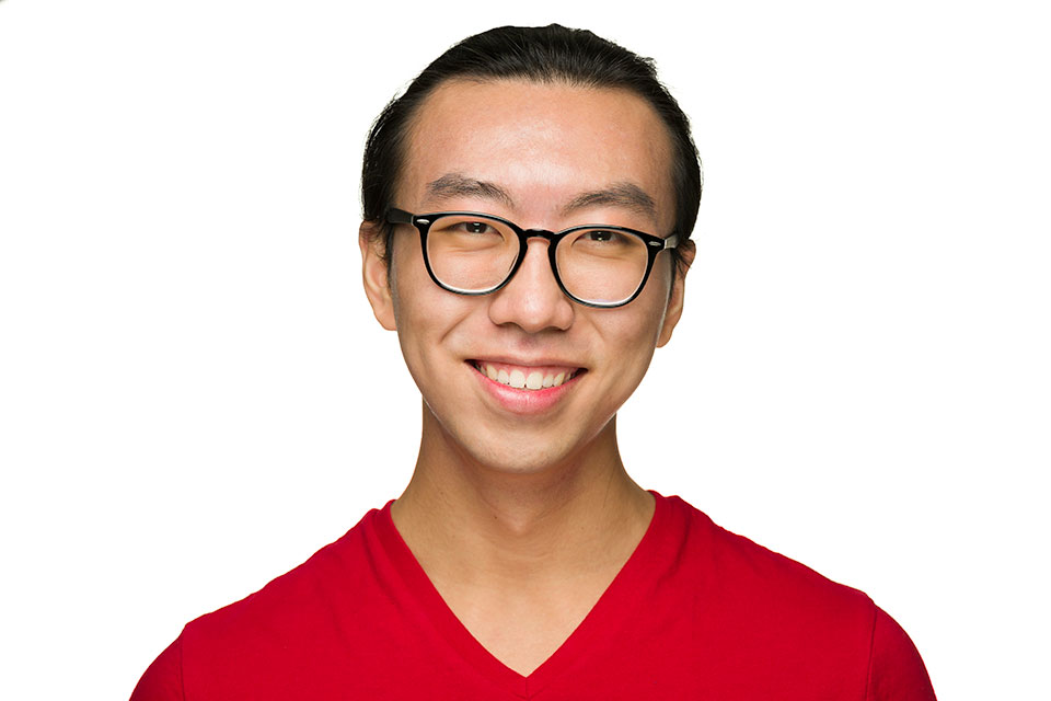 Zion Jang headshot, smiling, red shirt