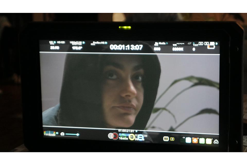 Alex Costello on camera in a film