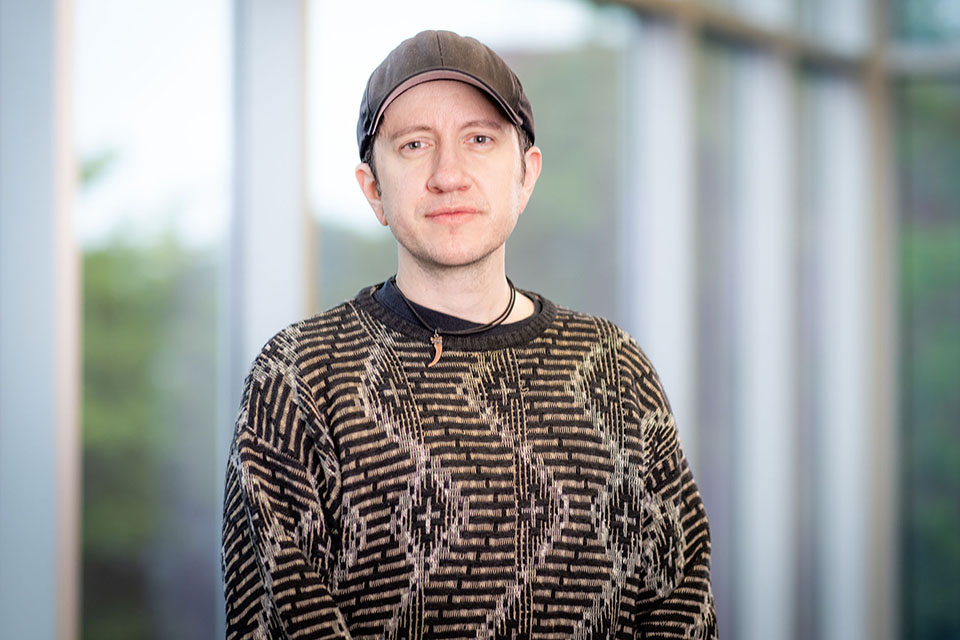Daniel Foerste poses in front of windows