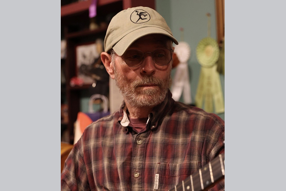 Rick Davidson playing the guitar