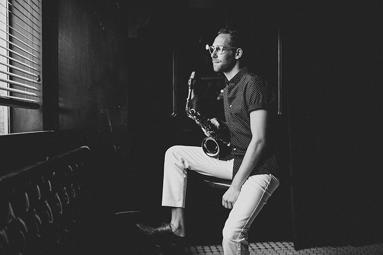 Owen Broder with saxophone
