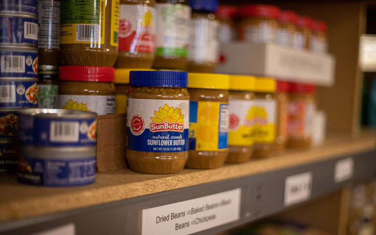 Non-perishable food on shelves in the Pickle Pantry.