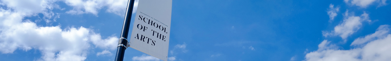 UNCSA banner against a blue sky
