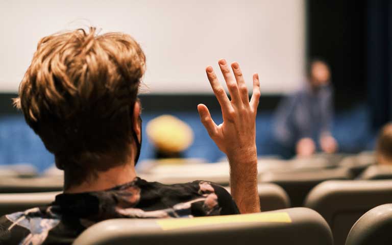 Film student raises hand in theatre