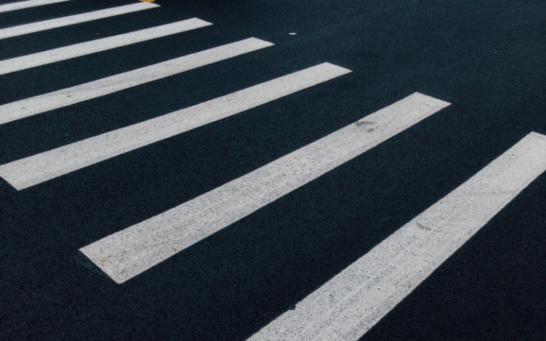 A close-up photo of fresh parking lot stripes