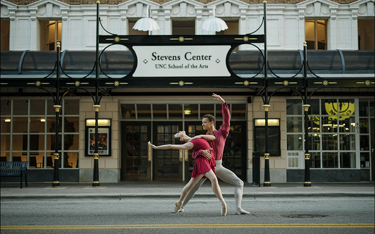 Two dancers in front of the Stevens Center.