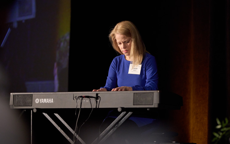 Lauren Coplan playing piano at the 2023 UNCSA Scholarship Luncheon. / Photo: Wayne Reich