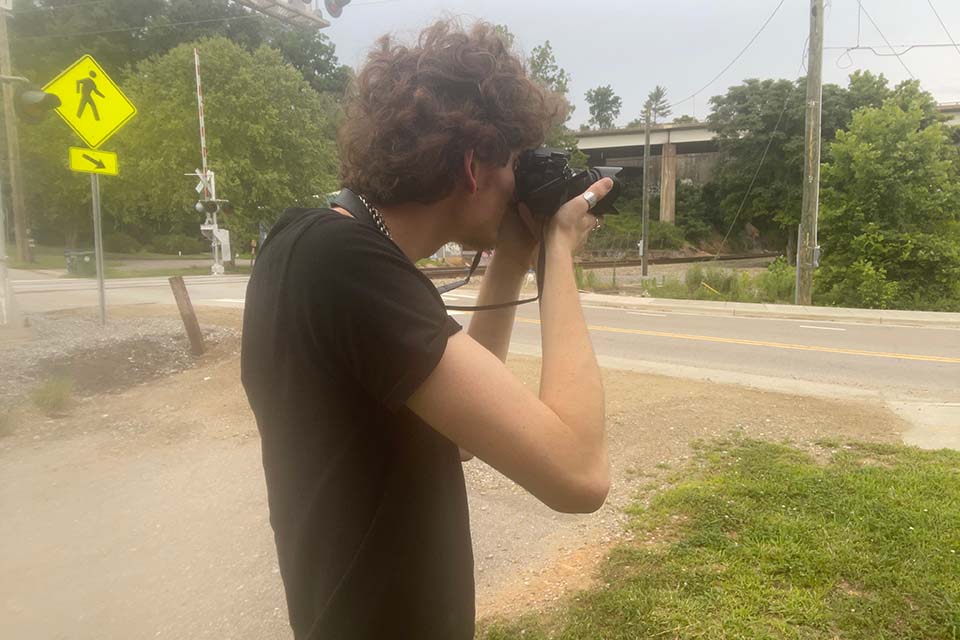 Emile Rizzo Banks photographing Asheville's River Arts District