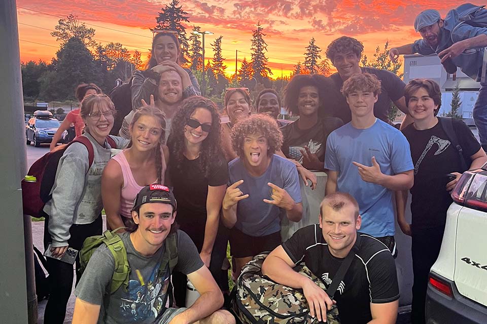 Hannah and Alex pose with the stunt school students