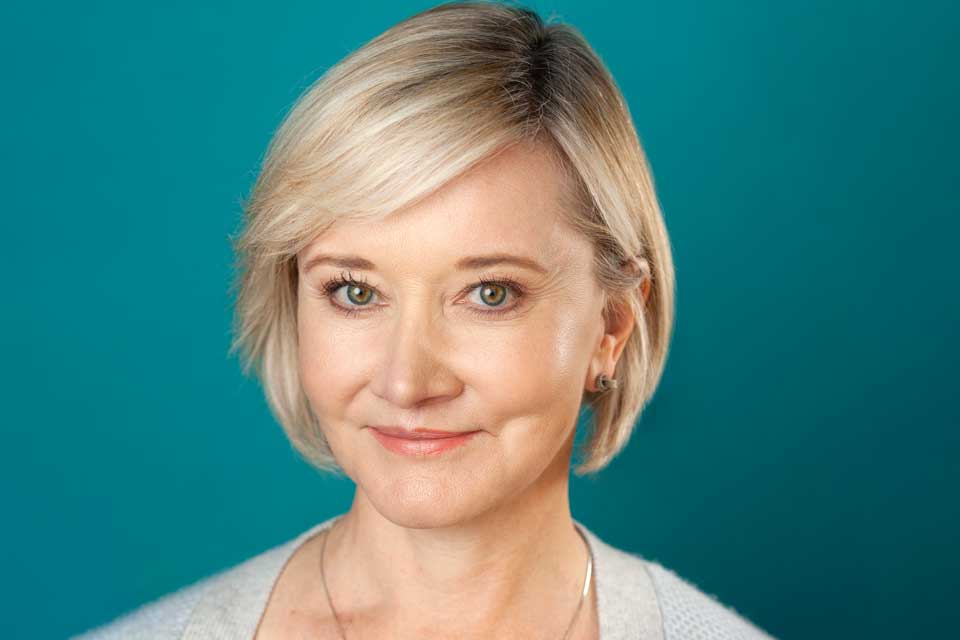 A woman smiling at the camera