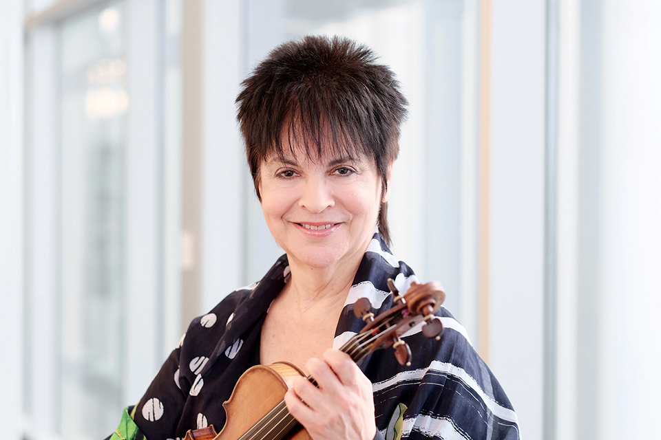 A woman smiling at the camera.