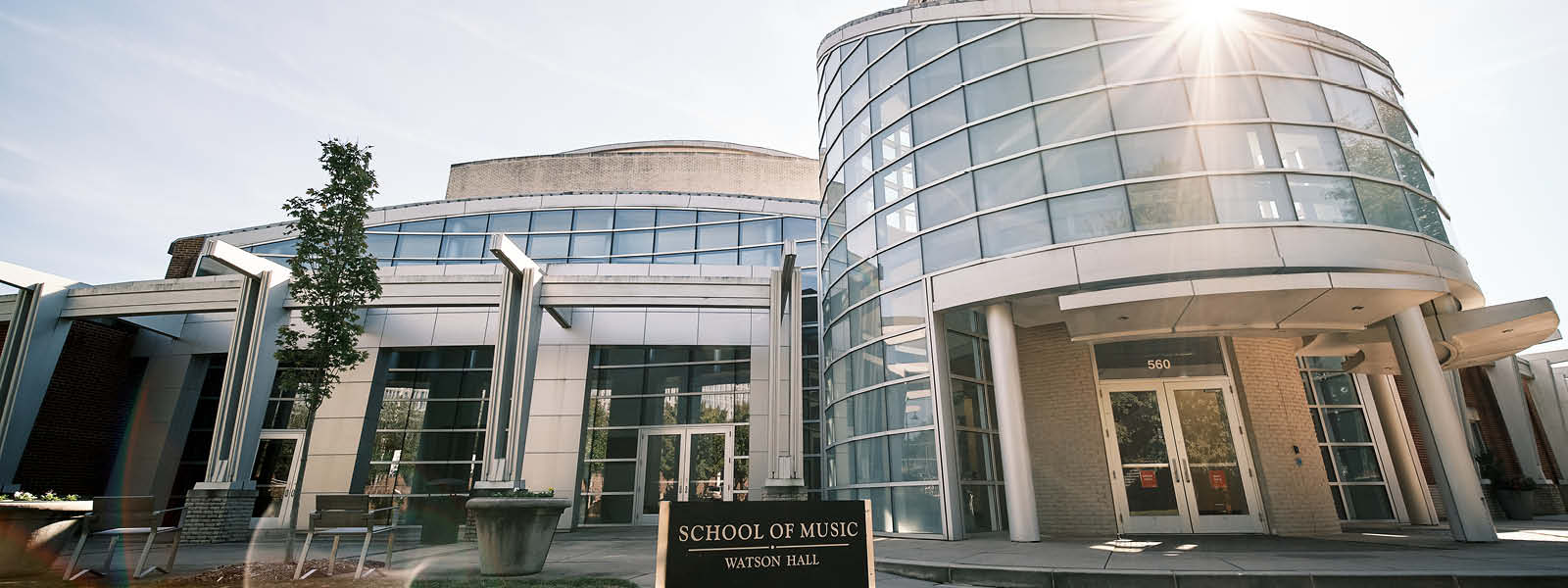 A tall building with large glass windows.