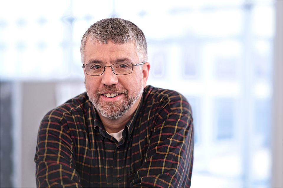 A man smiling at the camera