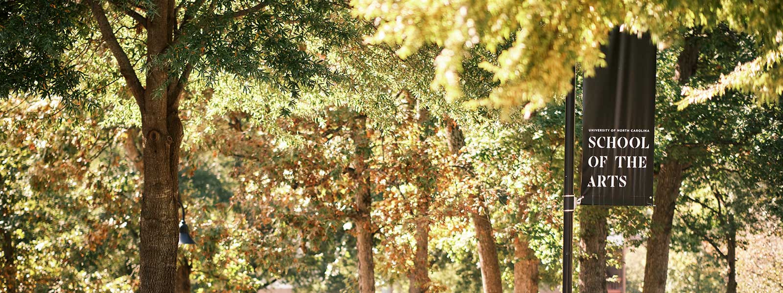 A sign displaying the words "School of the Arts" in bold letters against a simple background.