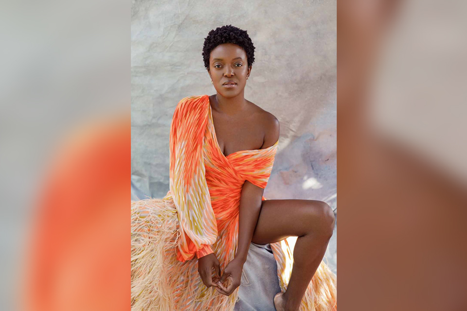 A woman starting sternly ahead.