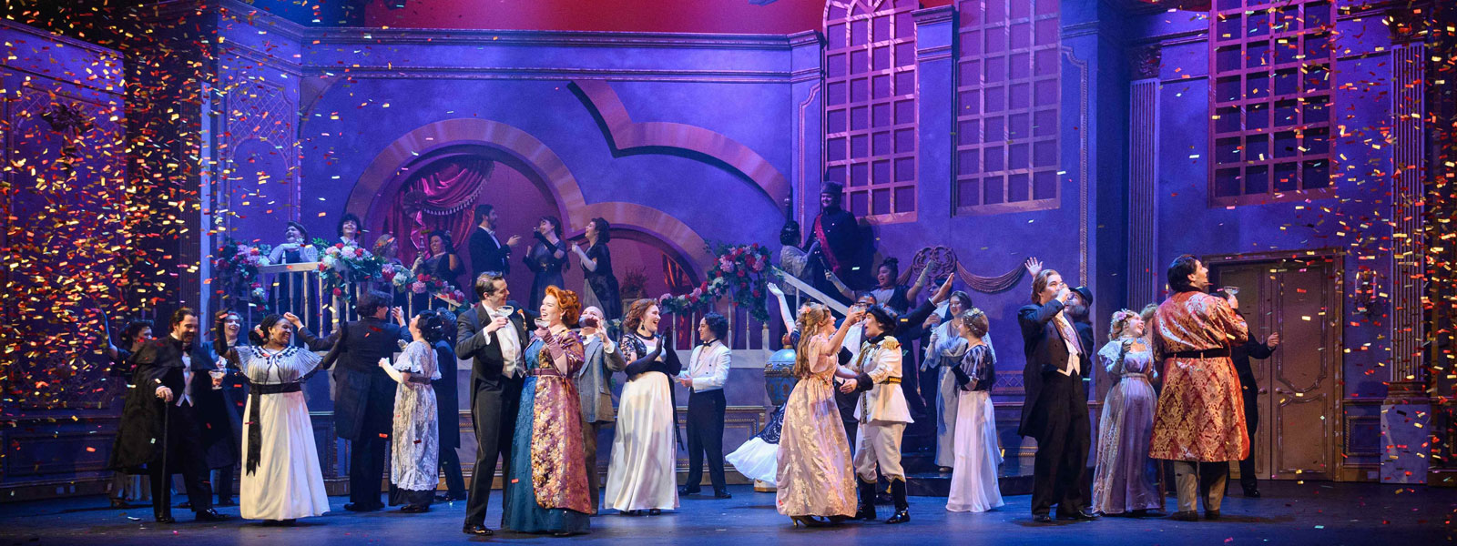 A group of costumed people on a stage.
