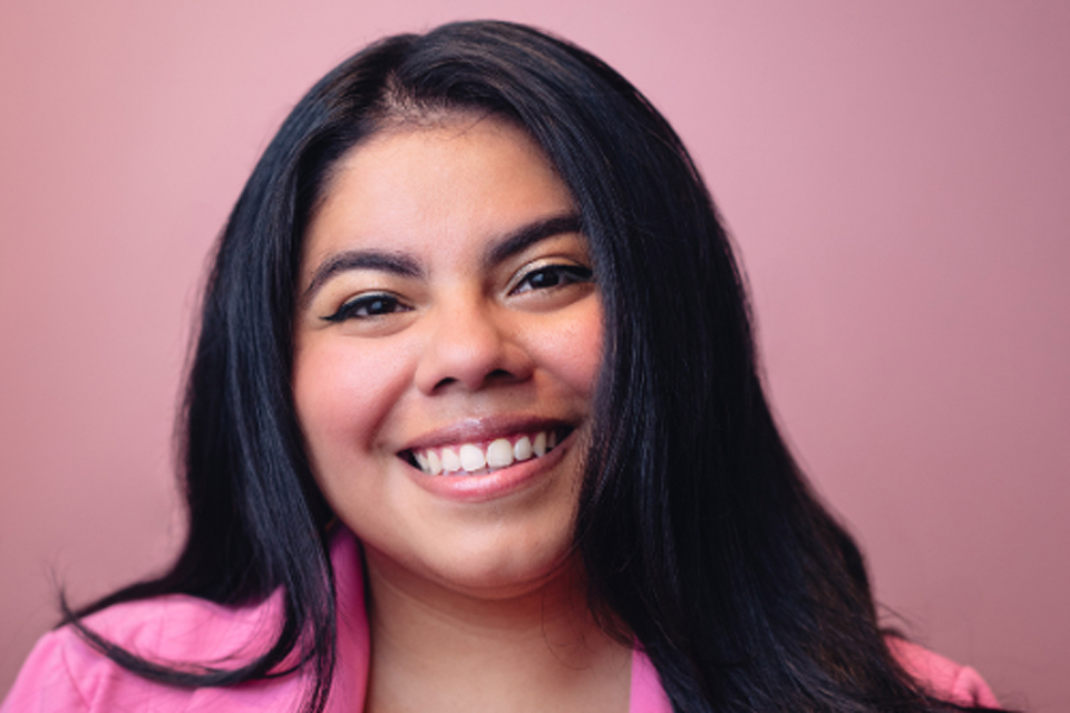 A woman smiling at the camera