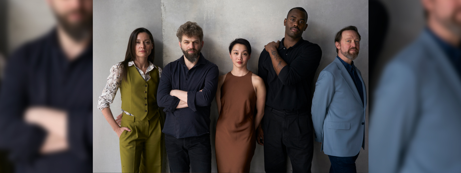 A group poses together, smiling and showcasing their characters' unique personalities.