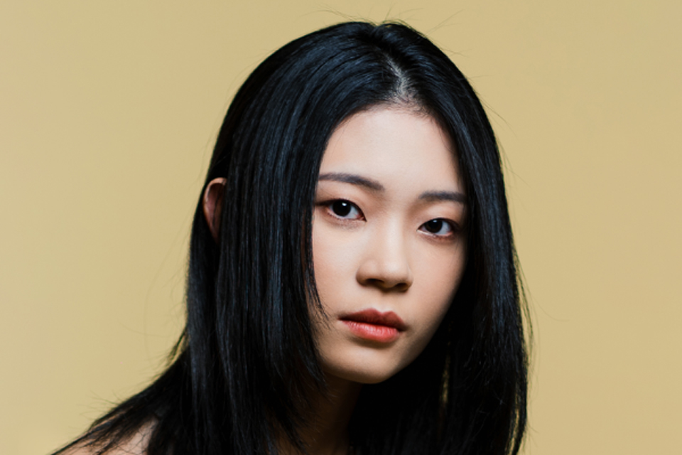 A woman looking strongly ahead.