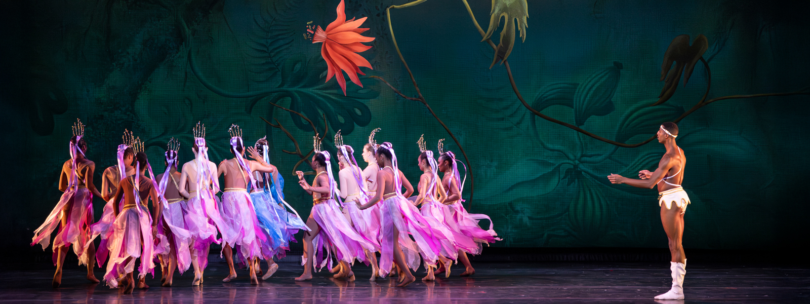 Dancers on stage performing in costume