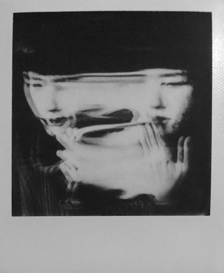 Double image of woman with blurred face